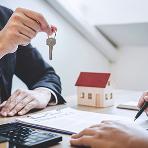 Attorney discussing defense of property laws with a client in a legal setting.